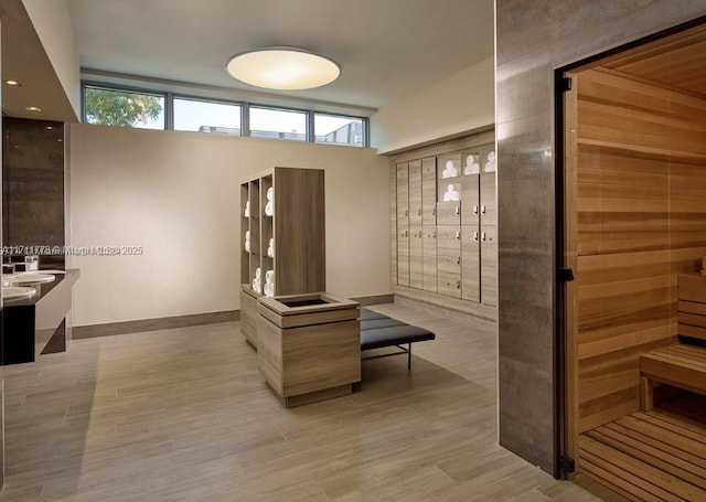 interior space featuring baseboards and wood finished floors