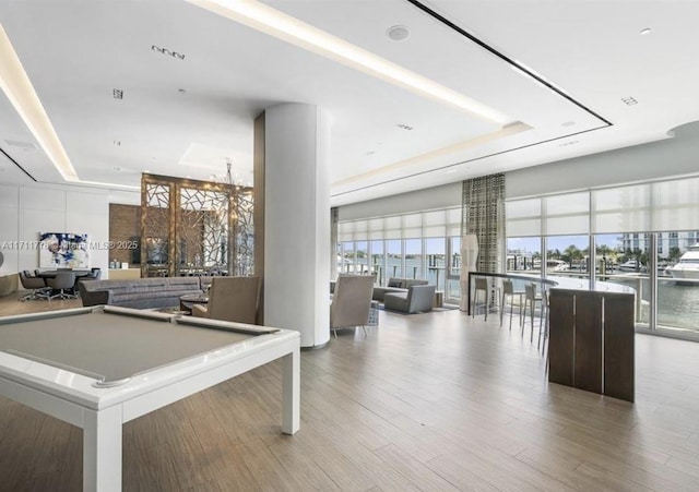 17301 Biscayne Blvd Unit 305, North Miami Beach, FL 33160 - playroom with a raised ceiling, a chandelier, wood finished floors, and billiards