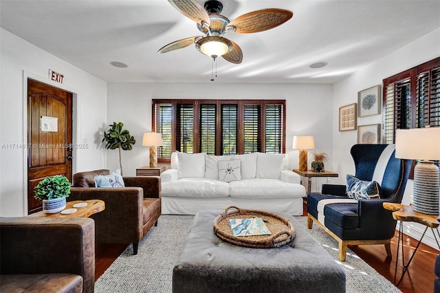 living room featuring ceiling fan and light wood-type flooring