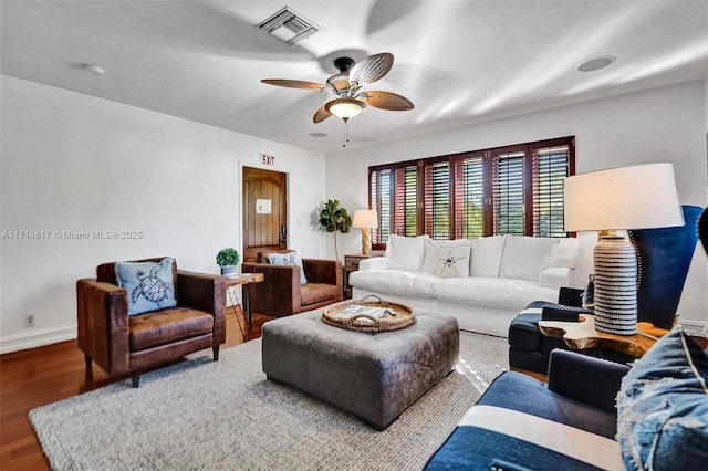 living room with ceiling fan and hardwood / wood-style floors