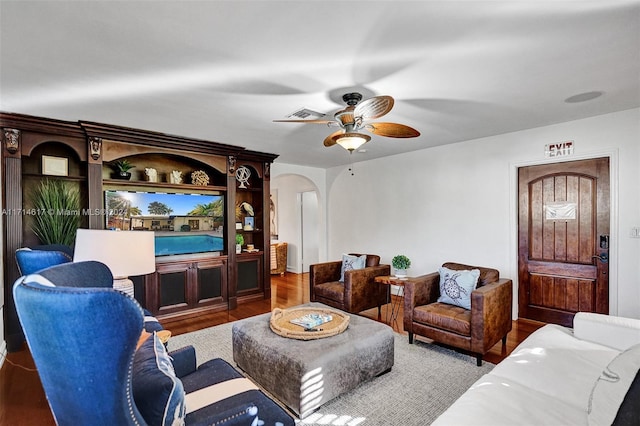 living room with hardwood / wood-style floors and ceiling fan