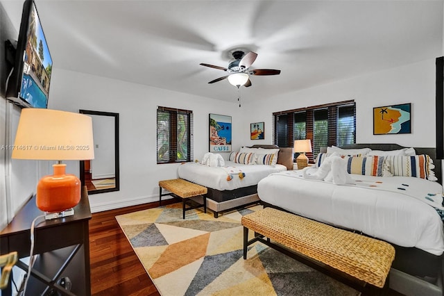 bedroom with wood-type flooring and ceiling fan