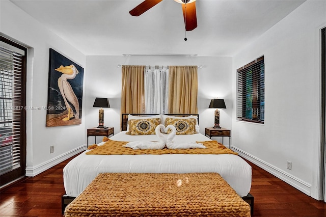 bedroom featuring dark hardwood / wood-style flooring and ceiling fan