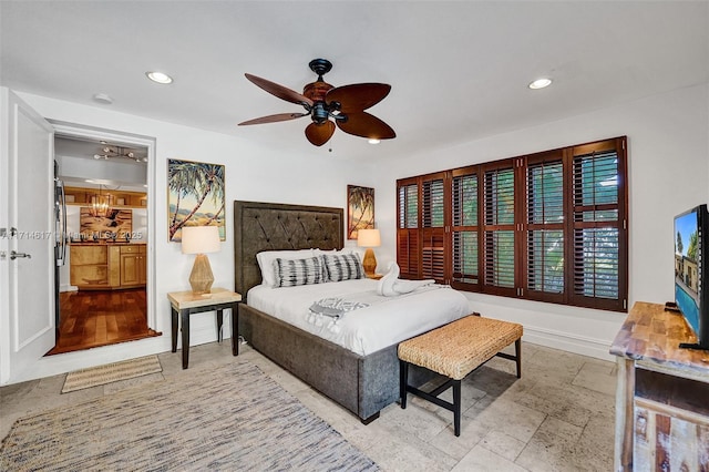 bedroom featuring ceiling fan and stainless steel refrigerator