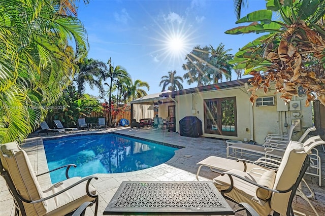 view of swimming pool with a patio