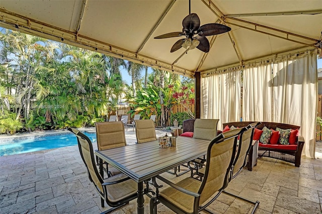 view of patio / terrace featuring ceiling fan and an outdoor living space