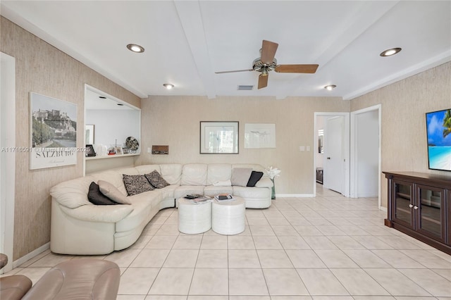 living room with beam ceiling, ceiling fan, and light tile patterned floors