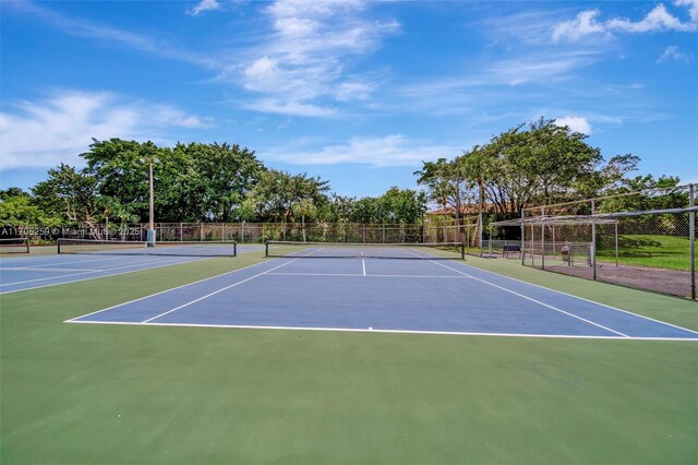 view of sport court featuring basketball hoop