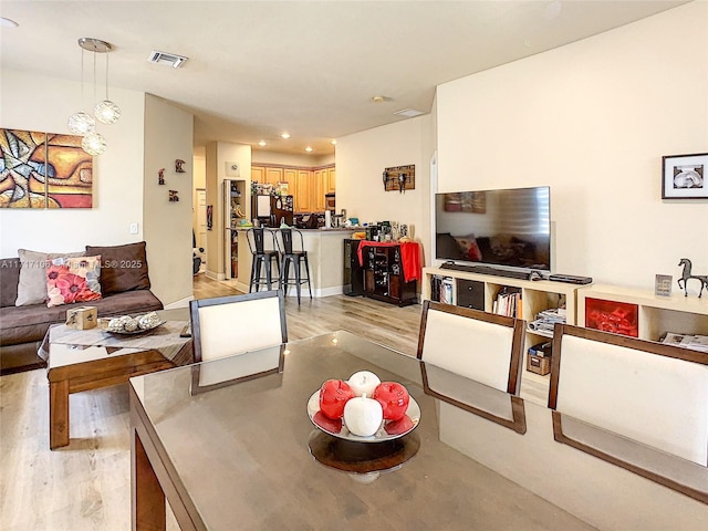 living room with light hardwood / wood-style flooring