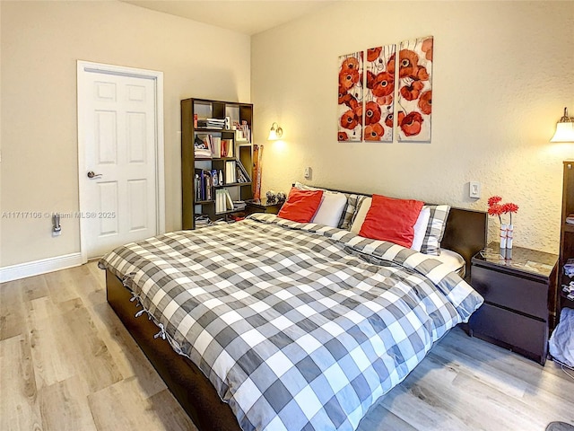 bedroom with light wood-type flooring