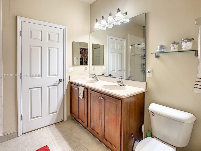 bathroom featuring a shower, tile patterned flooring, vanity, and toilet