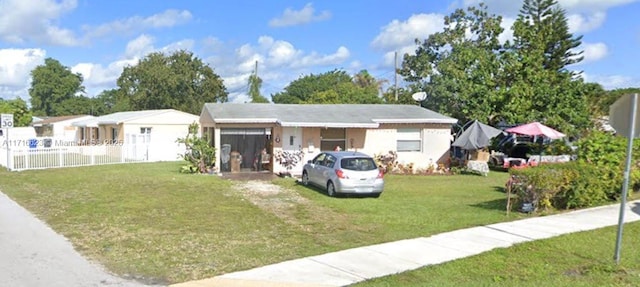 view of front of home with a front lawn