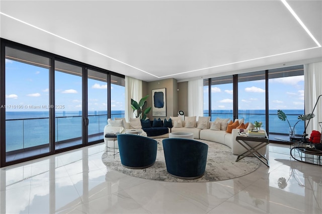 living room with expansive windows and a water view