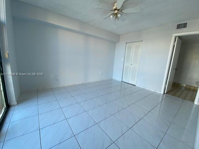 2055 SW 122nd Ave Unit 205, Miami, FL 33175 - empty room with a ceiling fan, tile patterned floors, and visible vents