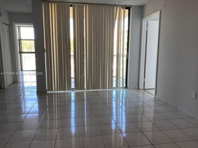 empty room with tile patterned floors