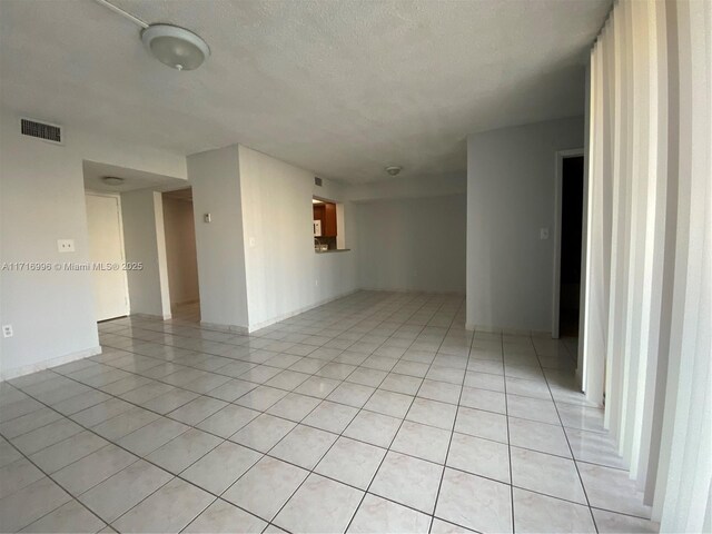 2055 SW 122nd Ave Unit 205, Miami, FL 33175 - spare room with light tile patterned flooring, a textured ceiling, and visible vents