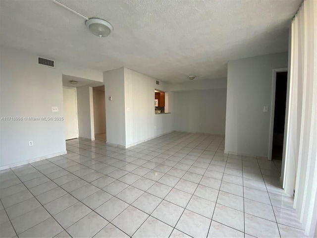 2055 SW 122nd Ave Unit 205, Miami, FL 33175 - spare room featuring a textured ceiling, visible vents, and light tile patterned floors