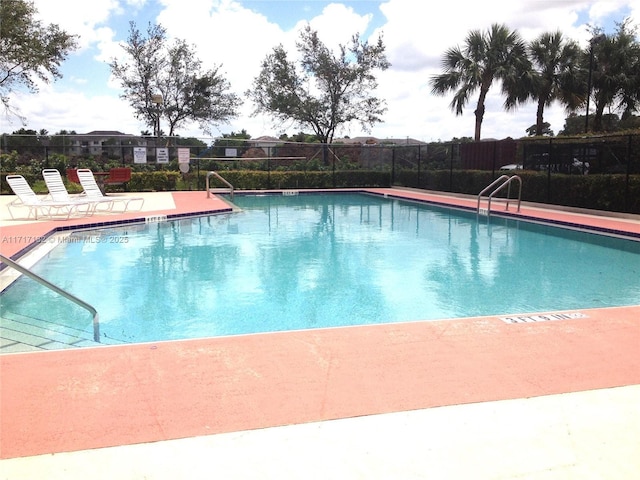 view of swimming pool with a patio