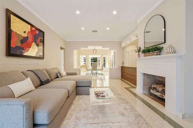 living room featuring a fireplace with flush hearth, visible vents, baseboards, recessed lighting, and ornamental molding