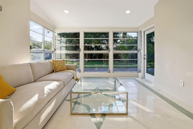 sunroom / solarium with baseboards, recessed lighting, and vaulted ceiling