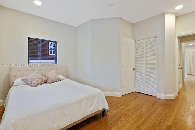 bedroom featuring recessed lighting, light wood-style flooring, and baseboards
