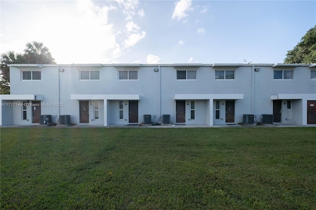 rear view of property featuring cooling unit