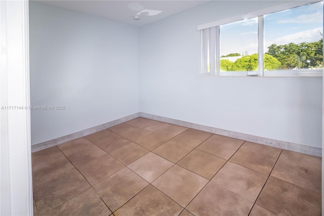 empty room with light tile patterned floors