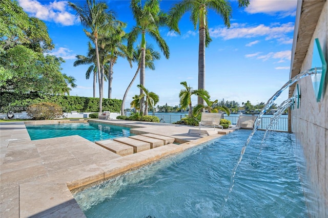 view of swimming pool with a patio