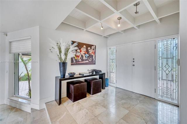 entrance foyer featuring beamed ceiling and coffered ceiling