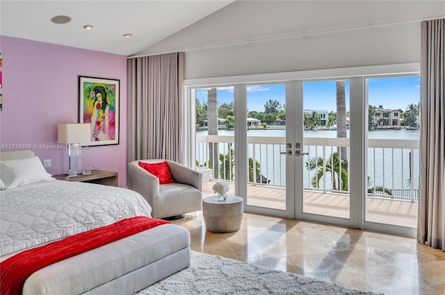 bedroom featuring a water view, multiple windows, access to outside, and french doors