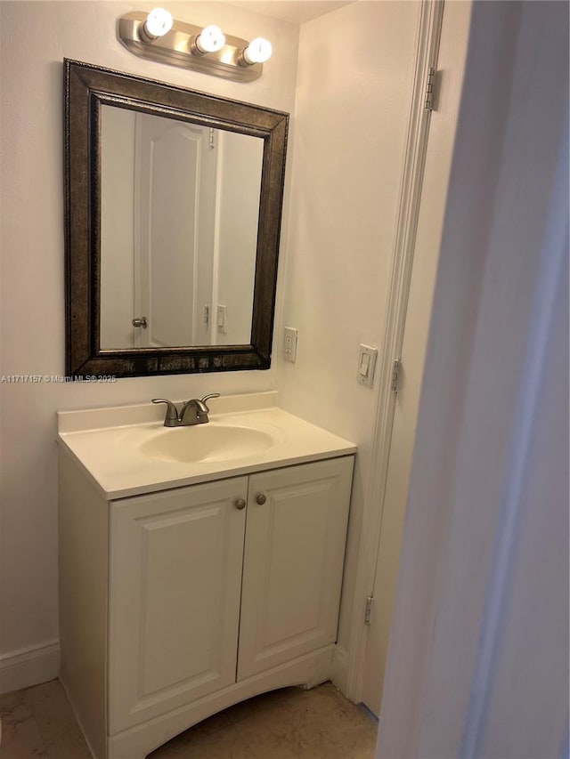 bathroom featuring tile patterned flooring and vanity