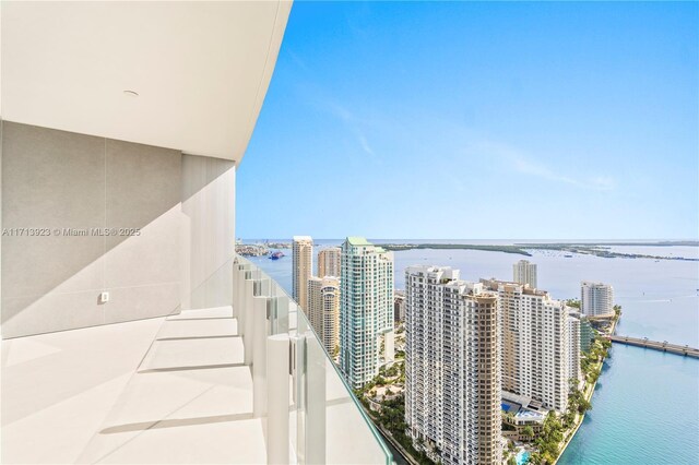 balcony featuring a water view