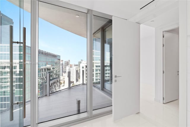 interior space with floor to ceiling windows and light tile patterned flooring