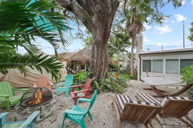 exterior space featuring a patio area and a fire pit