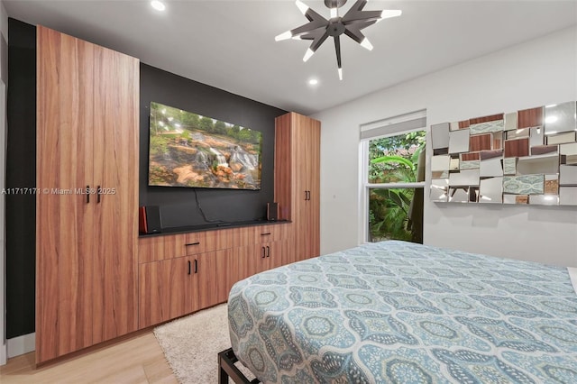 bedroom featuring ceiling fan and light hardwood / wood-style floors