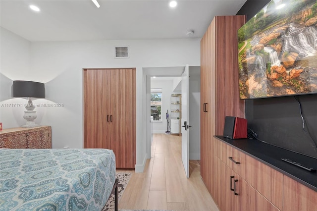 bedroom featuring light wood-type flooring