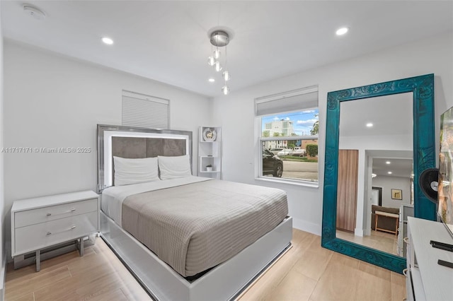 bedroom with light wood-type flooring