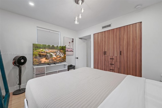 bedroom with light hardwood / wood-style flooring