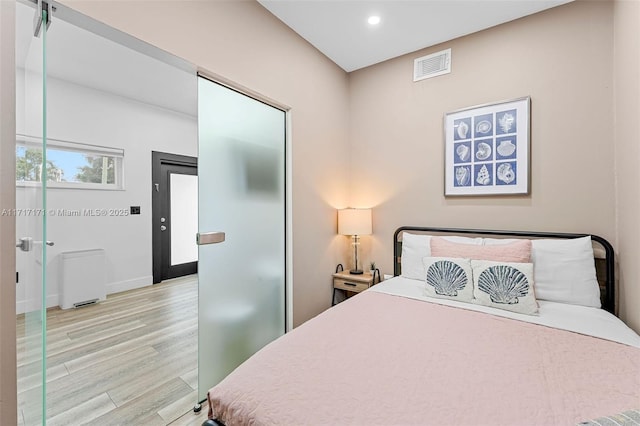 bedroom featuring light hardwood / wood-style floors