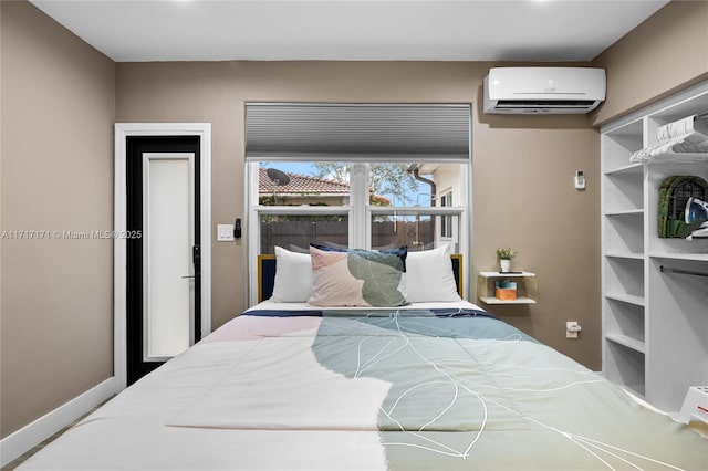 bedroom with a wall mounted air conditioner