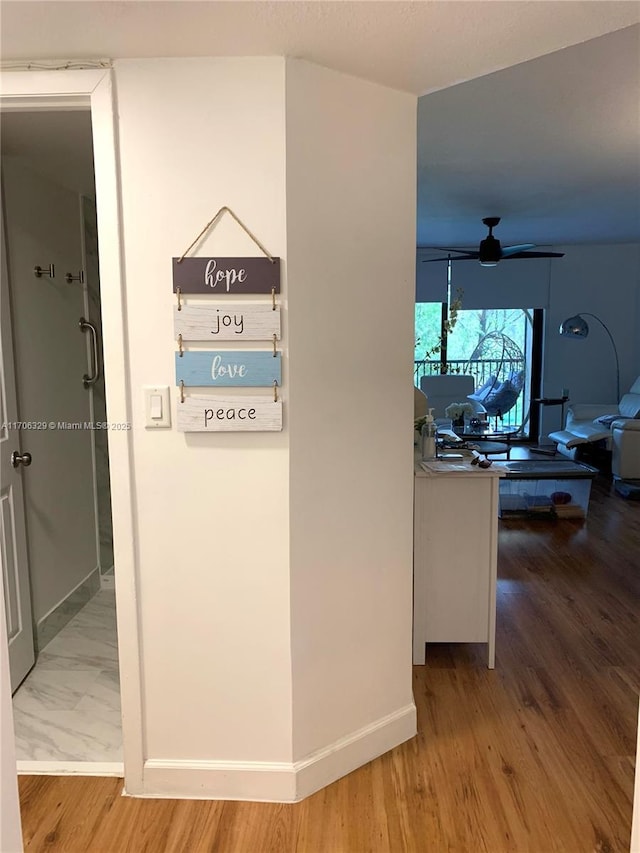 corridor featuring hardwood / wood-style flooring