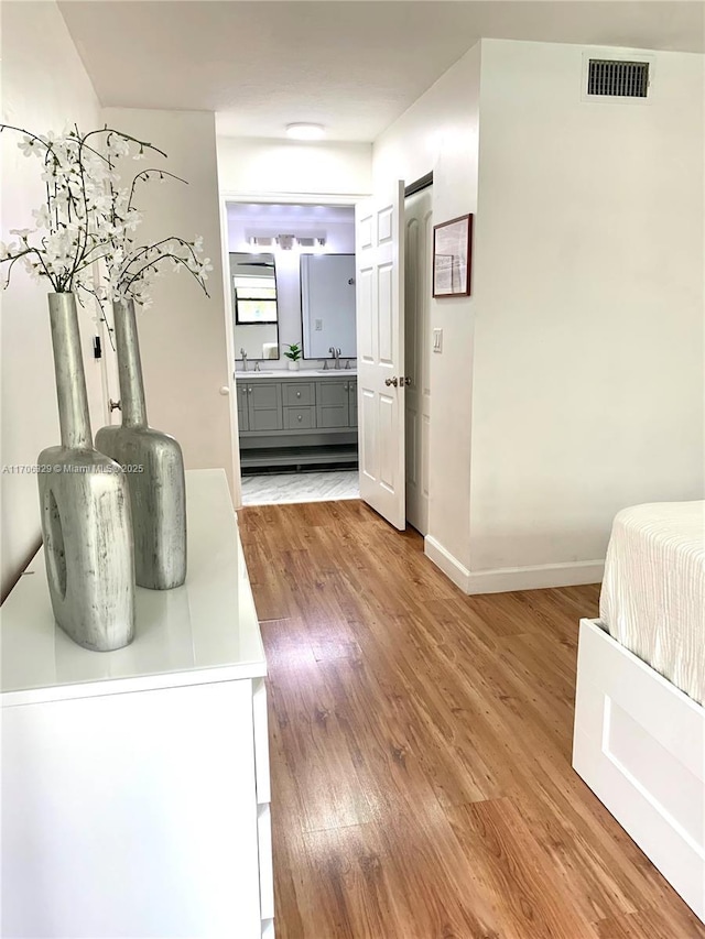 interior space with wood-type flooring and sink