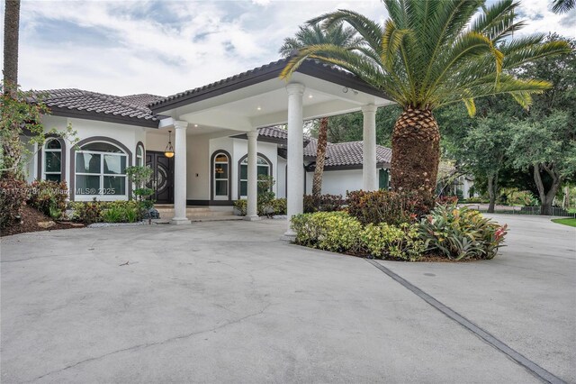13431 Old Sheridan St, Southwest Ranches, FL 33330 - view of front of home featuring a tile roof and stucco siding