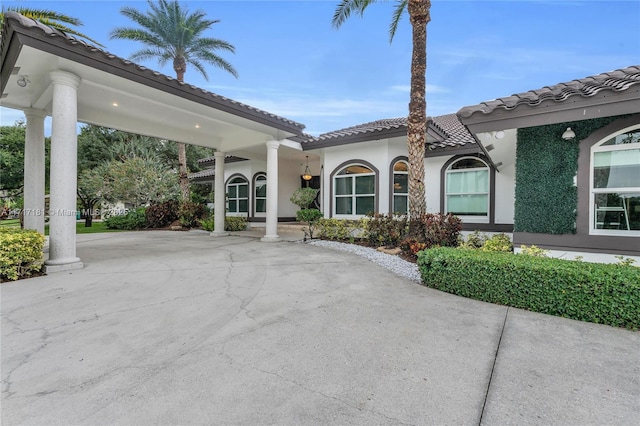 exterior space with concrete driveway