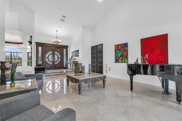 13431 Old Sheridan St, Southwest Ranches, FL 33330 - foyer entrance featuring a chandelier, a high ceiling, and marble finish floors