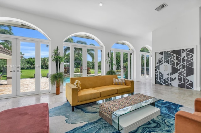 sunroom featuring french doors and visible vents