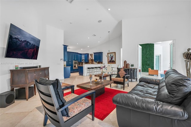 living room featuring light tile patterned floors, high vaulted ceiling, and recessed lighting