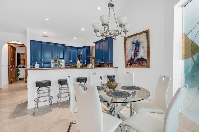 dining space with visible vents, arched walkways, vaulted ceiling, a notable chandelier, and recessed lighting