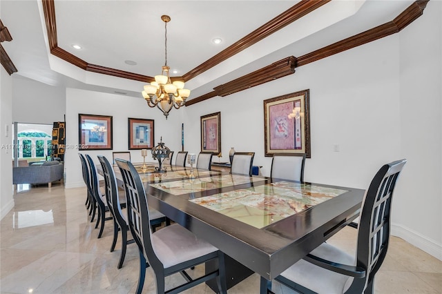 dining area with crown molding, baseboards, a raised ceiling, and an inviting chandelier