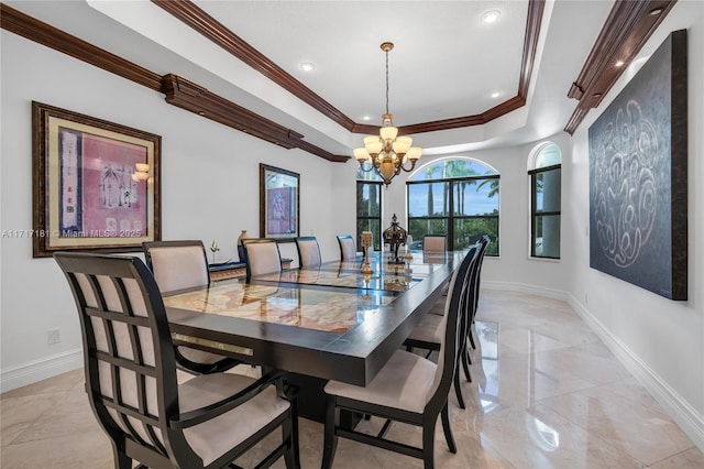 dining space with recessed lighting, an inviting chandelier, baseboards, a raised ceiling, and crown molding